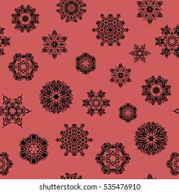 Vector abstract design. Seamless pattern of stylized snowflakes and dots on pink background.