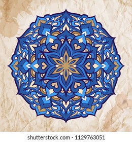 Vector abstract ethnic mandala motif on a grunge background.