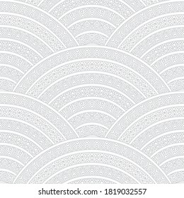 Vector abstract geometrical seamless pattern from silver grey ethnic ornaments, wavy stripes on a white background. Textile wavy seigaiha print. Folk batik paint. Bohemian decoration