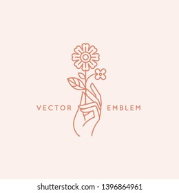 Vector Abstract Logo Design Template In Trendy Linear Minimal Style - Hand With Flower - Symbol For Cosmetics, Jewellery, Beauty Products 