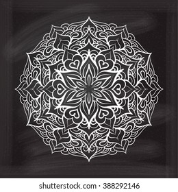 Vector abstract mandala pattern on a chalkboard background. 