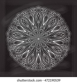 Vector abstract mandala pattern on a chalkboard background.