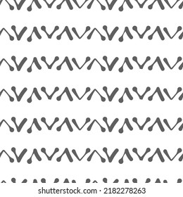 Vector.  Abstract monochrome ethnic seamless pattern. Artistic background hand drawn simple shapes of angle brackets, checkmarks. Mosaic abstract background. Repeating geometric texture. Dividers.