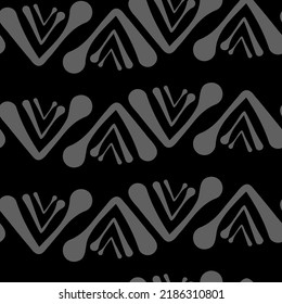Vector.  Abstract monochrome ethnic seamless pattern. Artistic background hand drawn simple shapes of angle brackets, checkmarks. Mosaic abstract background. Repeating geometric texture. Dividers.