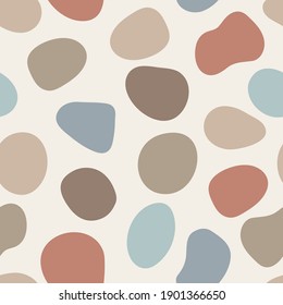 Vector abstract pebbles seamless pattern. Colorful artistic fluid organic shapes. Isolated neutral earth tone neutral colors graphic elements scattered on background. Natural backdrop illustration