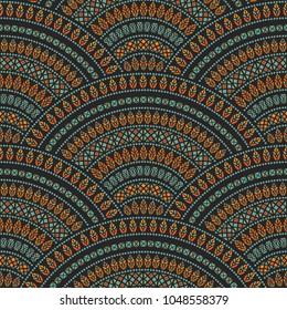 Vector abstract seamless geometrical background from dark colorful fan shaped ornate elements with ethnic patterns. Peacock tail silhouette with feathers on a black background. Batik, wallpaper