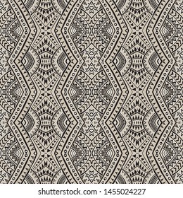 Vector abstract seamless pattern from black, grey and light beige ikat geometrical shapes, rhombus, triangles, Maori ornaments, waves, stripes. Textile print, Wrapping paper, wallpaper. Batik paint