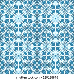 Vector abstract seamless pattern. Christmas background in white and blue colors. Winter texture for design with snowflakes. Holiday backdrop