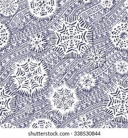 Vector abstract seamless pattern from indigo blue and light grey hand drawn contour geometrical ornaments, stripes and fantasy stylized cut paper snowflakes. Christmas and New Year holiday background
