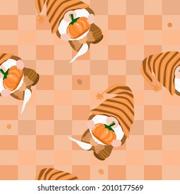 Vector - Abstract seamless pattern of orange checkered with gnome holding pumpkin. Autumn, fall season. Can be use for print, paper, fabric, wrapping, cloth.