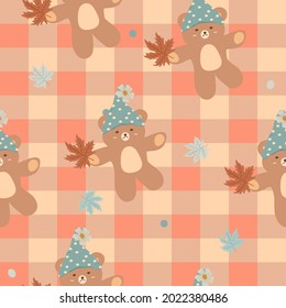 Vector - Abstract seamless pattern of orange checkered with teddy bear holding maple leaves. Autumn, fall season. Can be use for print, paper, fabric, wrapping, cloth.