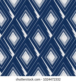 Vector abstract seamless pattern whit drawn by brush rhombuses.Modern stylish texture.Blue background