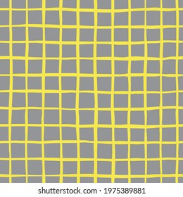 Vector abstract seamless pattern with yellow crossed lines on grey background. Checkered backdrop in simple rough style. Illustration in colors of the year. Perfect for fabrics and wrapping paper. 