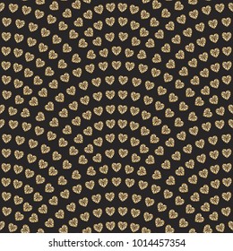 Vector abstract seamless wavy pattern with geometrical fish scale layout. Faceted gold colored hearts on a dark black background. Fan shaped Valentine Day ornament. Wrapping paper, wallpaper