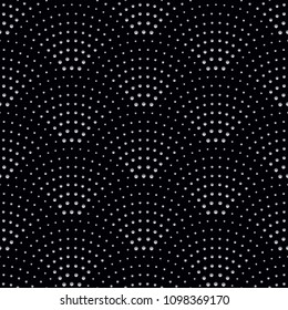 Vector abstract seamless wavy pattern with geometrical fish scale layout. Silver grey circles on a dark black background. Fan shaped firework burst .Wallpaper, textile patch, wrapping paper, page fill