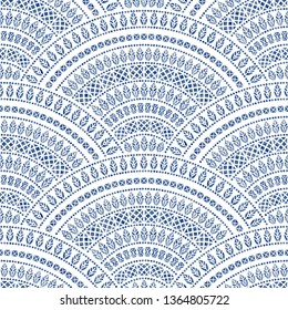 Vector abstract seamless wavy pattern from decorative ethnic ornaments with dark blue watercolor paint texture on a light grey background. Regular fan shaped ornamental elements