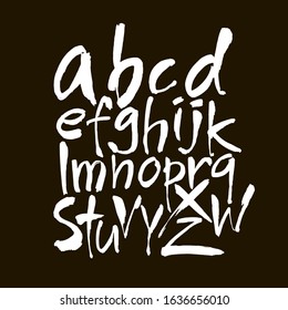 Vector Acrylic Brush Style Hand Drawn Alphabet Font. Calligraphy alphabet on a black background. Ink hand lettering.