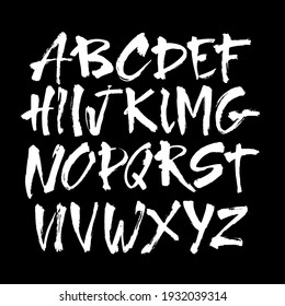 Vector Acrylic Brush Style Hand Drawn Alphabet Font. Calligraphy alphabet on a black background. Ink hand lettering.