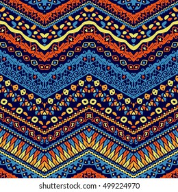 Vector african style chevron pattern with tribal motifs.