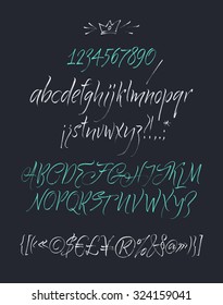 Vector alphabet. Hand drawn letters, numbers and decorative elements. Letters of the alphabet written with a brush. Chalk letters on a blackboard