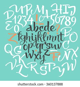 Vector alphabet. Hand drawn letters, numbers and decorative elements. Letters of the alphabet written with a brush