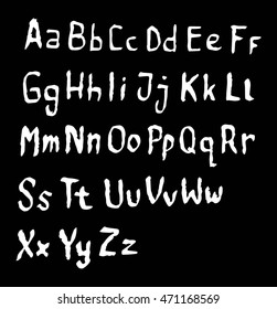 Vector alphabet. Hand drawn letters on Black background. Letters of the alphabet written with a pen brush.