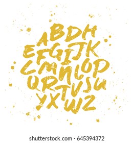 Vector alphabet. Hand drawn letters written with a brush. Gold on white background