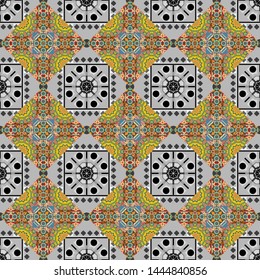 Vector Arabic ornament in blue, yellow and gray colors. Ornamental motifs of the Indian fabric patterns. Paisley floral oriental ethnic seamless pattern.