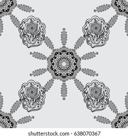 Vector art. Brilliant lace, stylized flowers, paisley. Seamless pattern on gray background with white elements. Seamless white texture curls. Oriental style arabesques. Openwork delicate white pattern