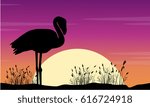 vector art flamingo scene at sunse silhouette 
