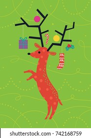 Vector art illustration of stylized graphic reindeer with Christmas ornaments hanging from its antlers against a green background