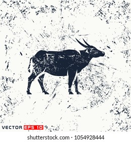 Vector asiatic buffalo silhouette on grunge background