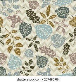 Vector autumn leaves doodle seamless pattern.Silhouette leaf and  branches on zigzag background . Use for pattern, wallpaper, web page , backdrop, wrapping paper, fabric , background .Vector