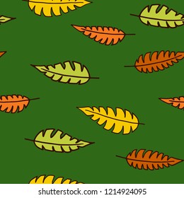 vector autumn leaves seamless pattern on a green background