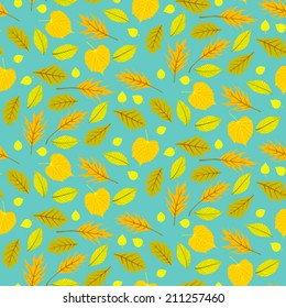 Vector autumn seamless background with pattern of various leaves and branches in bright colors - in turquoise, gold, green, yellow. Floral print for summer fall fashion