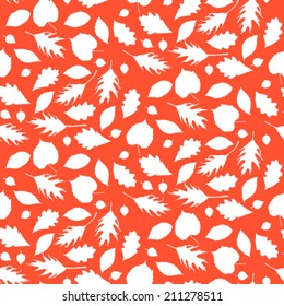 Vector autumn seamless background with pattern of various leaves silhouettes and branches in coral red and white. Bold floral print for summer fall fashion