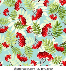 Vector autumn seamless pattern with rowan branches on a blue background.