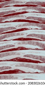 vector background consisting of bacon strips arranged in a pattern