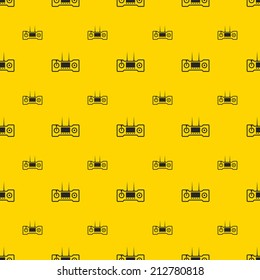 Vector background for game control. Seamless vector pattern with black contour controllers on yellow background.