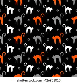 Vector background with hand drawn silhouette with white cats, orange nice kittens and gray paws in seamless pattern