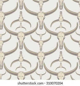 Vector background with the image of buffalo skulls. Seamless pattern.