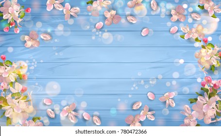 Vector background with spring cherry blossom flowers on a blue wooden background