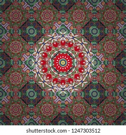 Vector background. Vintage abstract mandala colorful seamless pattern in blue, green and red colors.