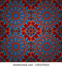 Vector background. Vintage abstract mandala colorful seamless pattern in orange, blue and red colors.