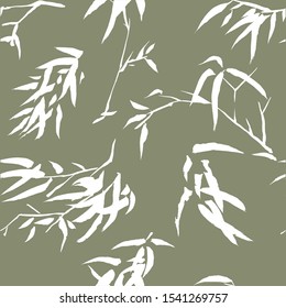 Vector bamboo leaves and branches silhouette seamless pattern. Autumn colours leaves background.