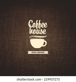 vector banner with a cup of coffee on a background fabric texture