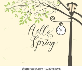 Vector banner with inscription Hello Spring. Spring landscape with green tree in the park and Clock on the lamp post