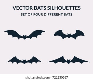 Vector bats silhouettes isolated on white background. Set of four bats with different shapes. Icons for Halloween design.