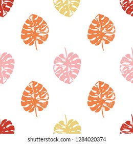 Vector beach seamless pattern wallpaper of autumn colored tropical leaves of palm trees on a white background. Vector seamless pattern. Tropical illustration. Jungle foliage. Cool floral wallpaper