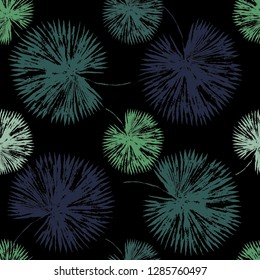Vector beach seamless pattern wallpaper of blue and green tropical leaves of palm trees on the black background. Vector seamless pattern. Tropical illustration. Jungle foliage. Cool floral wallpaper
